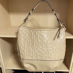 A nice CK Tote bag in beige color with logo print